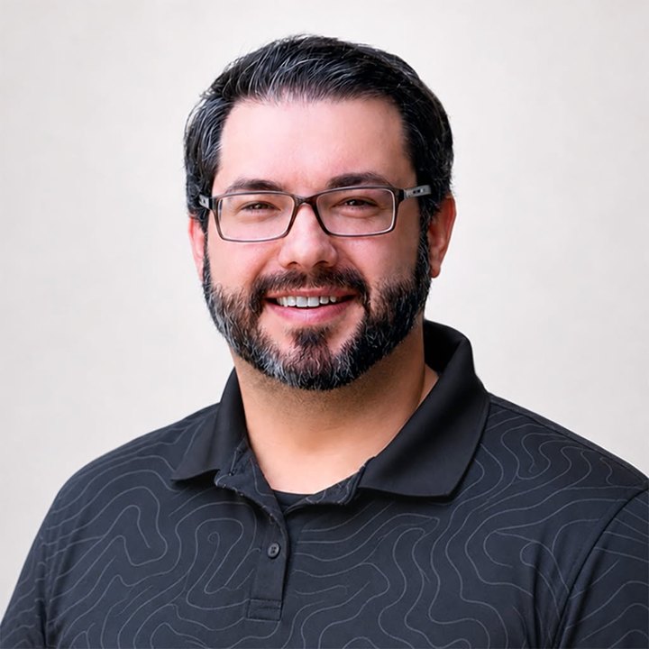 Grant Garrison, smiling, in a dark shirt